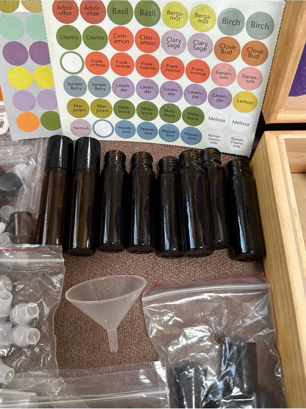 DōTerra essential oil box with 13 new/opened exp oils with extra bottles/info.